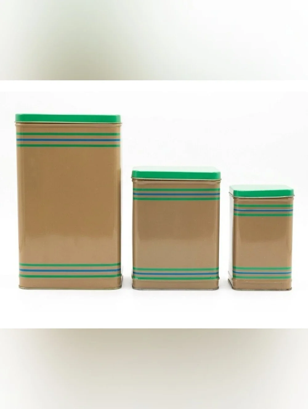 LASLO - Set of 3 Nesting Tan Metal Canisters with Green Lids and Stripes.